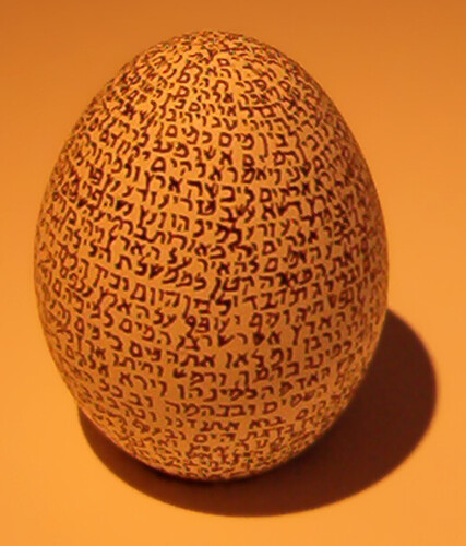 Genesis written on an egg